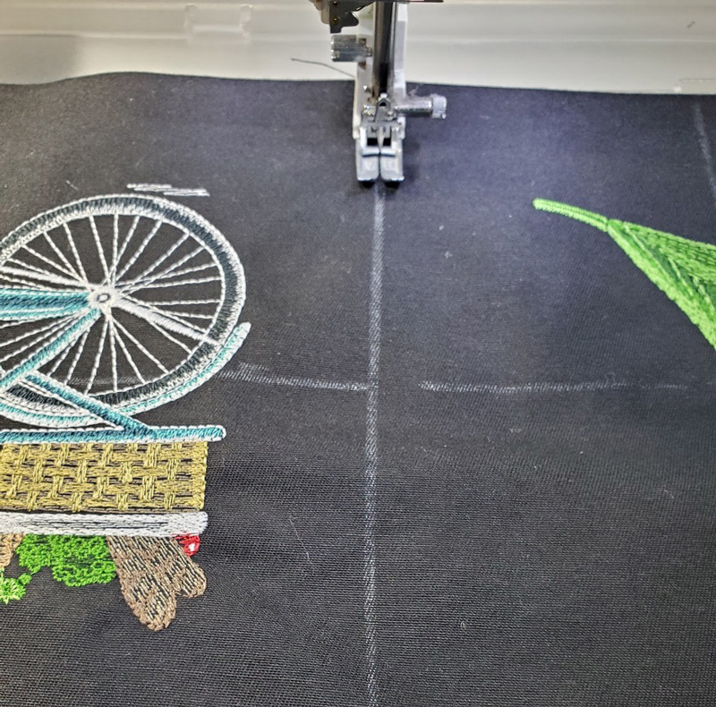 Springtime Garden Apron stitch designs on embroidery machine, then stitch apron seams
