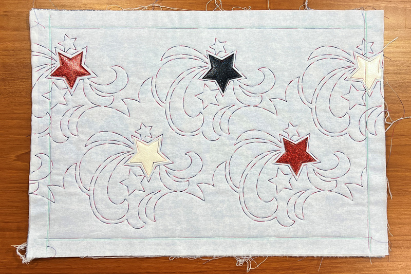 Stars & Stripes Quilted Placemats stitch edges of placemat
